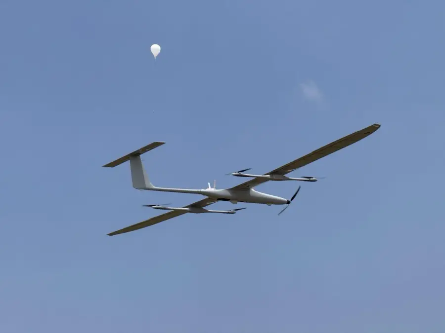A fixed-wing drone flying a mapping pattern.