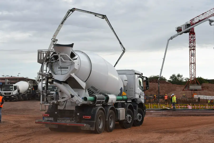 Concrete truck and boom pump on a building site
