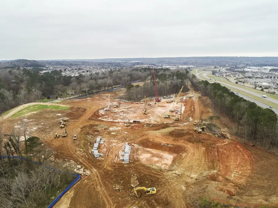 A cleared site with haul roads and pads taking shape.