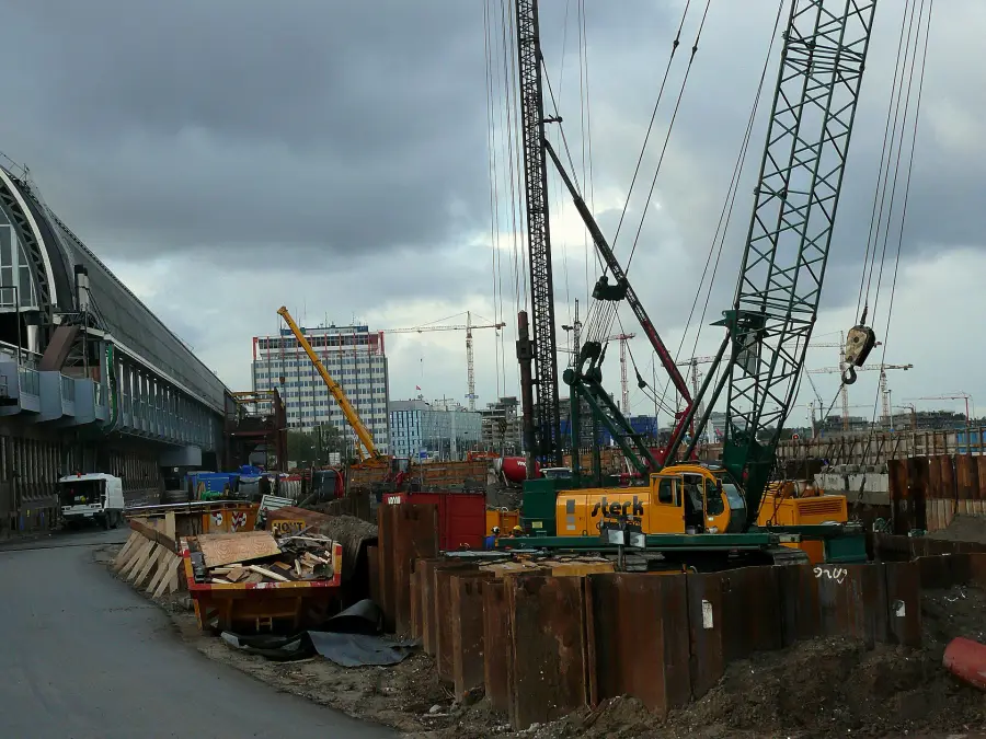 Cranes driving piles for a waterfront structure.