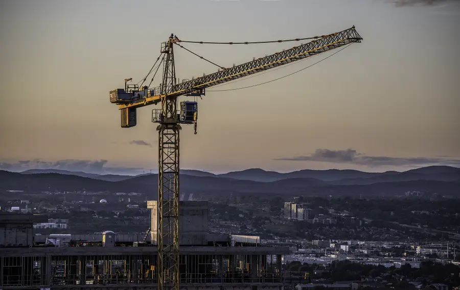 Tower crane silhouetted at dusk